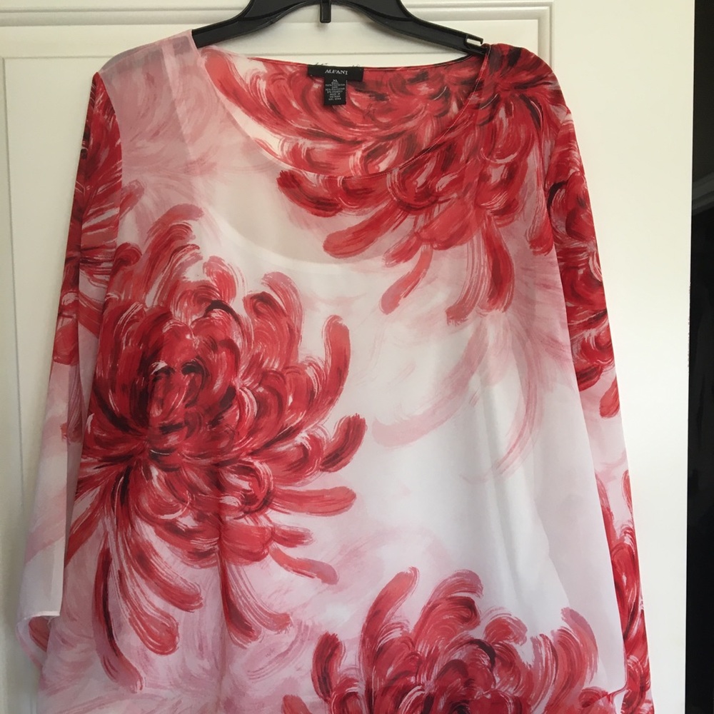 Pretty top with built in camisole & bubble hem.